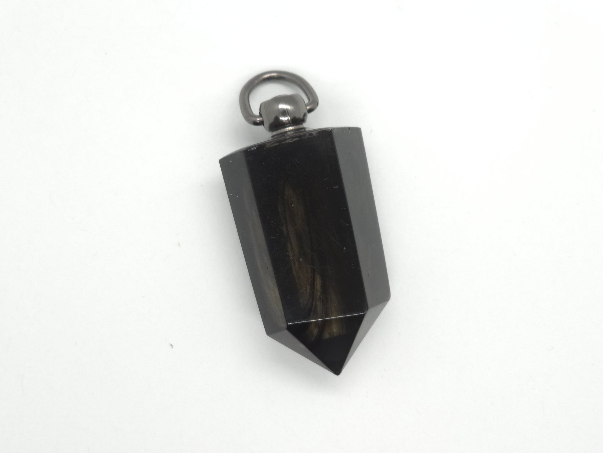 Black crystal pendant on a white background